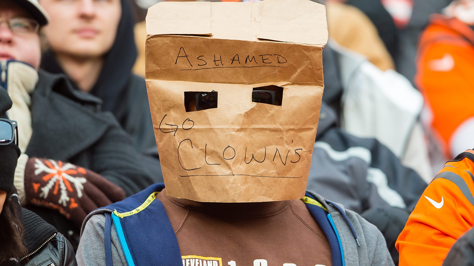 Browns fan with bag on head.