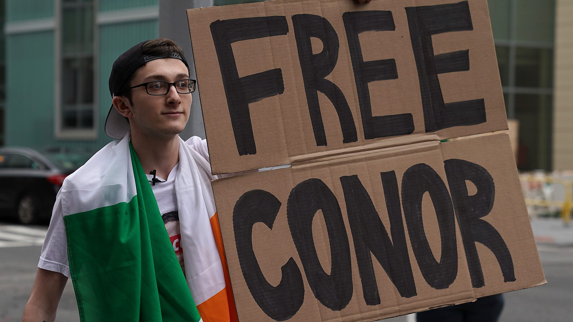 Robbie Fox stands outside the courtroom to support Conor McGregor