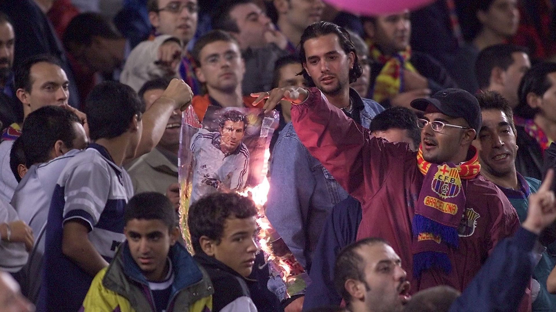 Barcelona fans burn an image of Figo