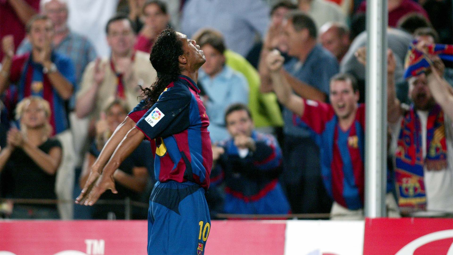 Ronaldinho celebrates scoring on his Barcelona debut against Sevilla