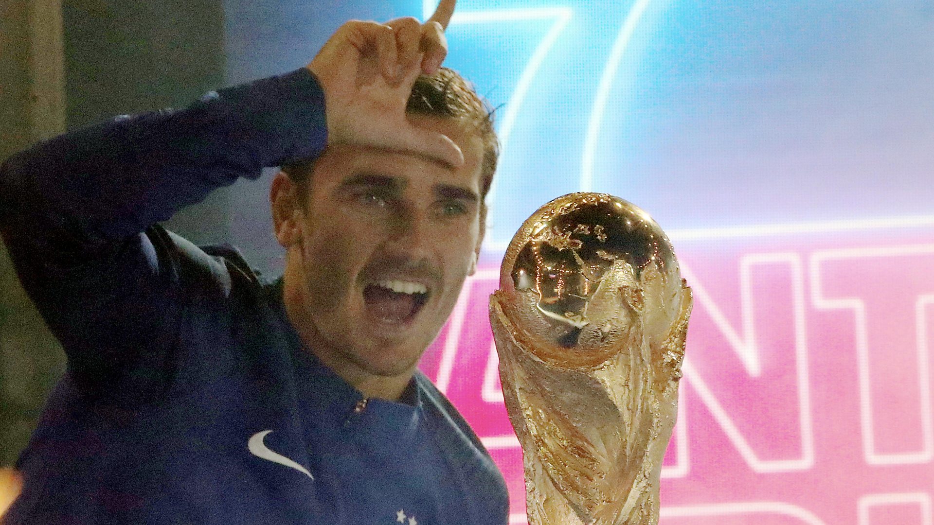 Antoine Griezmann with the World Cup, doing the L
