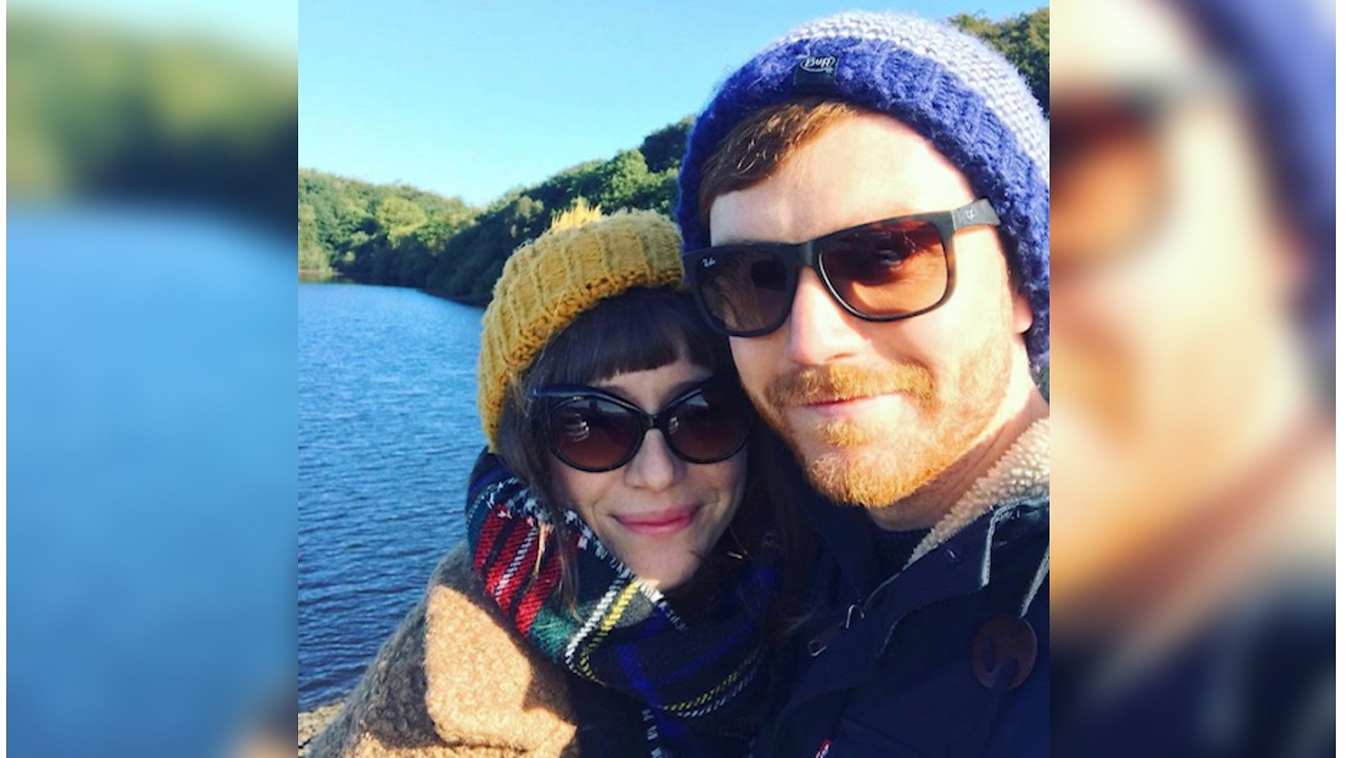 Photo Lorna and Rob posing for a selfie in front of a lake