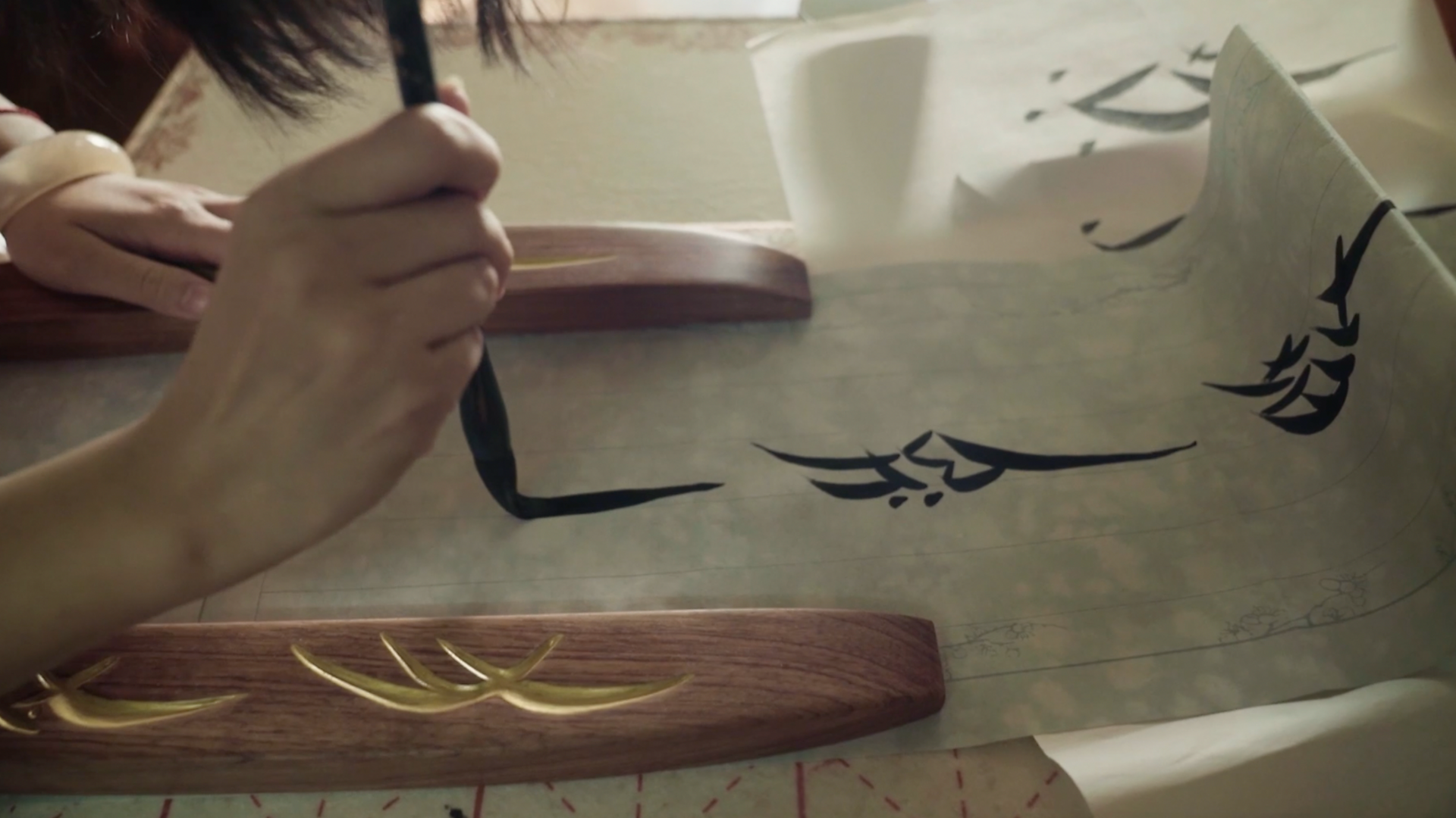 Women painting Nushu letters