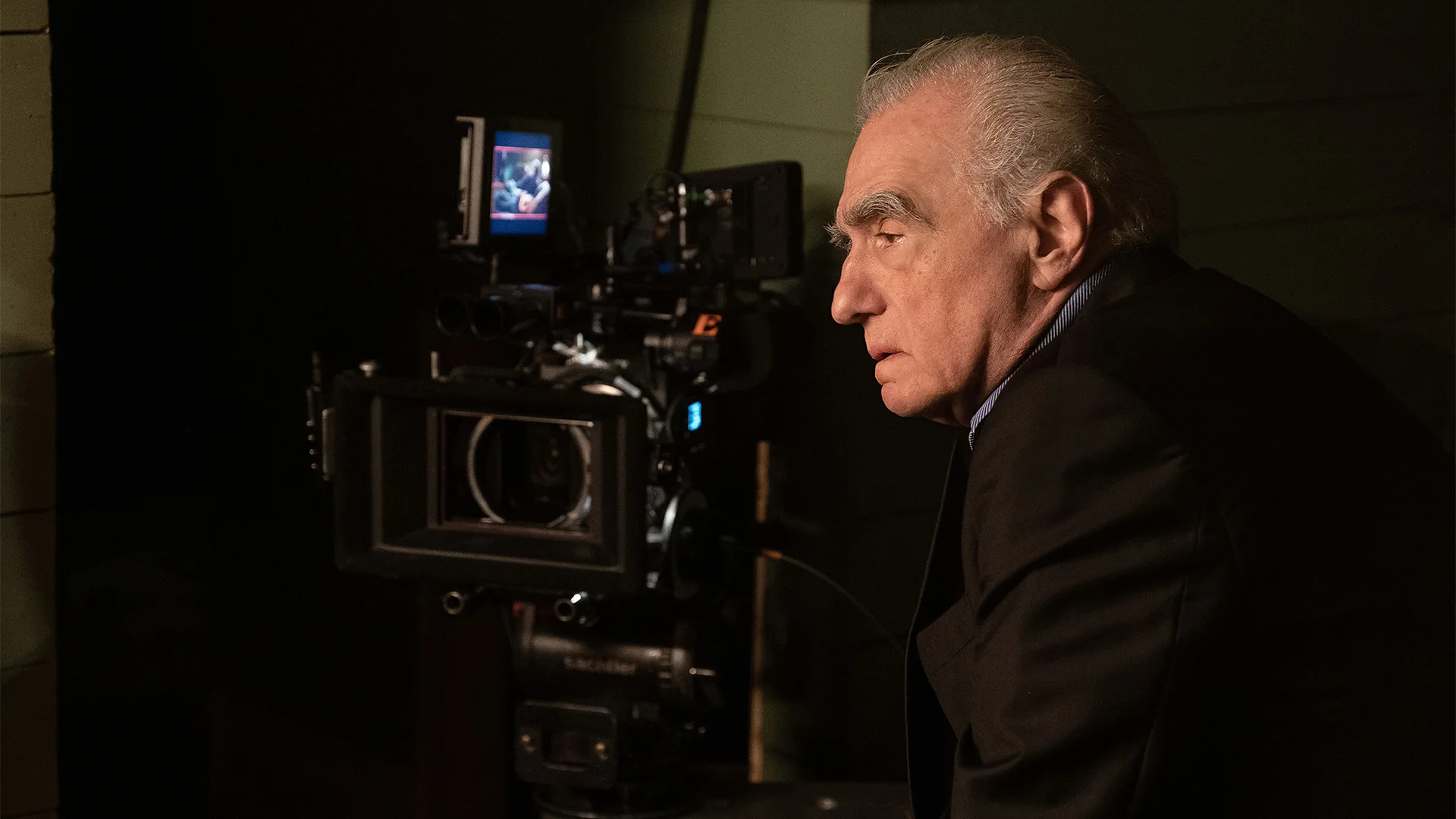 A still of Martin Scorsese stood next to a film camera in Mr Scorsese (Credit: Apple TV+)