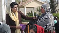 Handing the microphone to Afghan women