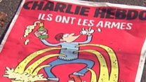 「あいつらには銃、我々にはシャンパン」 風刺紙シャルリー・エブド表紙に市民の反応は?