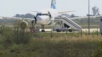 Person jumps from hijack plane cockpit