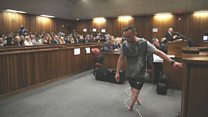 Pistorius walks on his stumps in court