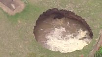 Giant sinkhole swallows garden