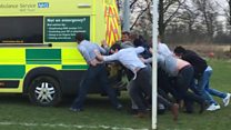 Watch: Rugby players rescue a stuck ambulance