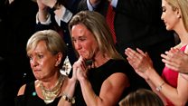 Navy widow weeps as Trump pays tribute