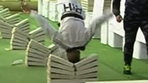 Man crushes concrete blocks with head