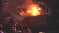 One dead in huge Oakland building fire