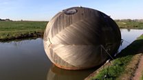Inside a giant wooden floating egg