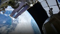 Astronauts take spacewalk