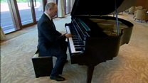 Putin plays piano ahead of Xi talks