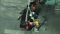 Aerials show Times Square car in flames