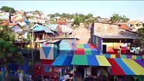 Why are people taking selfies in this slum?