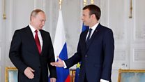 Macron greets Putin at opulent Versailles