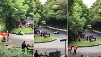 Sidecar crew narrowly misses TT crowd