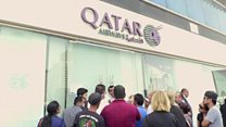Qatar Airways passengers wait for news