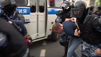 'Police are pulling people out at random'