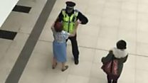 Policeman dances in shopping centre