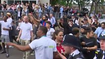Theresa May heckled by angry crowds