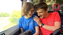 Couple visiting all British railway stations