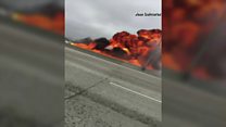 Plane crashes into truck on US freeway