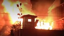 Inmates escape as prison burns