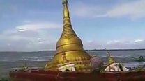 Pagoda collapses into river
