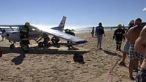 Plane landing on Portugal beach