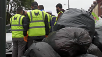 Volunteers clear rubbish from streets