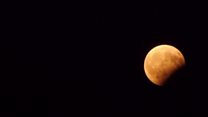 Red moon during partial lunar eclipse