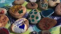 Painted pebbles brighten up seaside