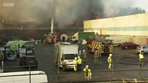 Firefighters tackle huge warehouse blaze