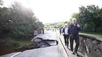 Bridge collapses in flooding