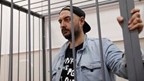 Director's fraud trial draws protesters