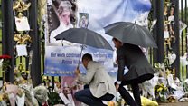 William and Harry lay flowers for Diana