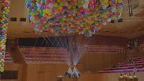 Woman suspended from 20,000 balloons