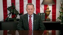 Defiant Moore lists what's wrong with US