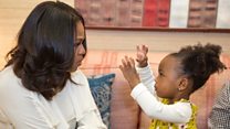 Michelle Obama dances with portrait girl