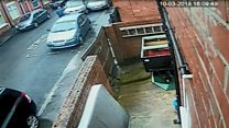 CCTV released after man carried along by car