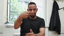 Deaf refugees in a foreign land