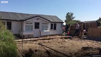Home dragged back from crumbling cliff