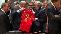 Theresa May receives a Belgium football shirt