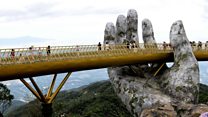 Walking in a god's hands on Vietnam bridge
