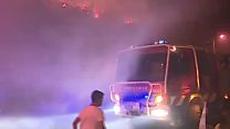 Wildfires rage around Algarve town