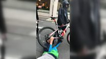 Cyclist dragged across road in mugging